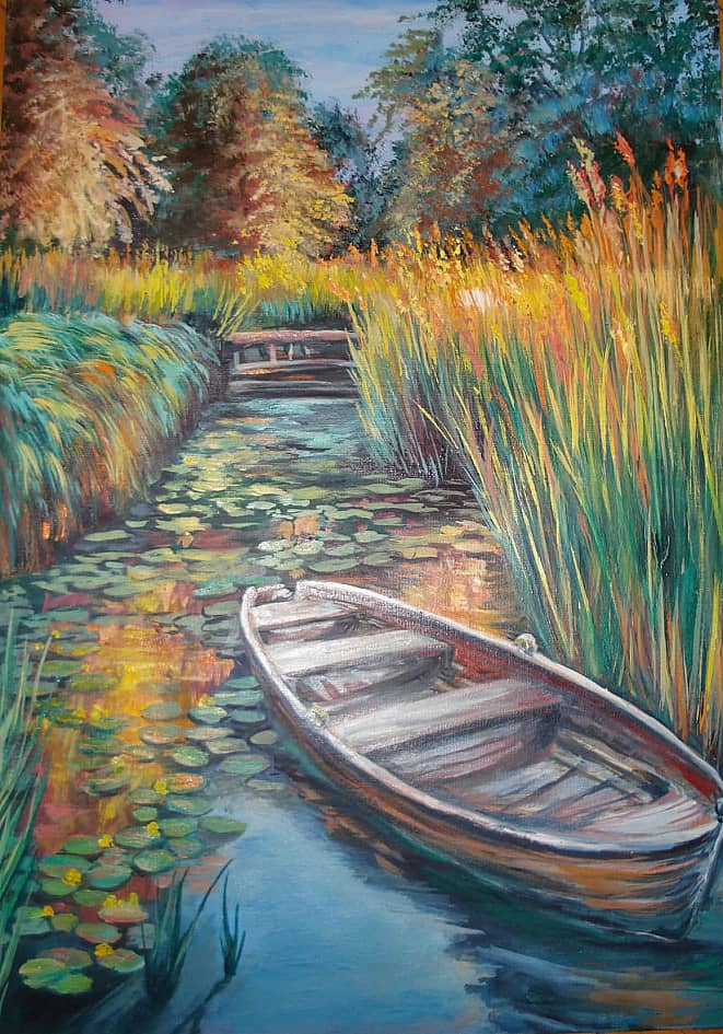 На воде. В камышах.